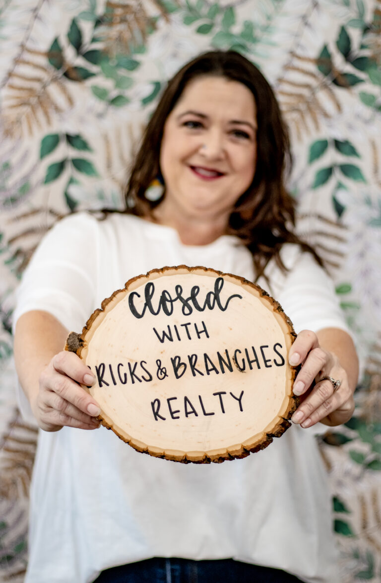 Courtney Hedrick Realtor Bricks & Branches Realty Closed Sign after selling a home